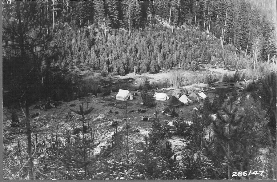 Photo by Ken Davis, Fall 1933 showing CCC spike camp. Caption reads: "View of the Sands Creek administration site (Deception Creek Experimental Forest headquarters) near the Honeysuckle Ranger Station headquarters. The site was originally an old homestead and later a logging camp. November 1, 1933."