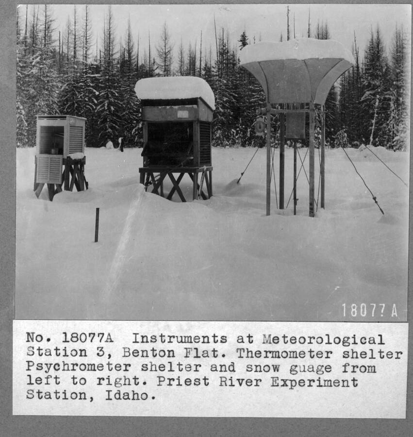 Instruments at Meteorological Station 3, Benton Flat. Thermometer shelter, Psychrometer shelter, and snow gauge from left to right. PRES, Idaho."
