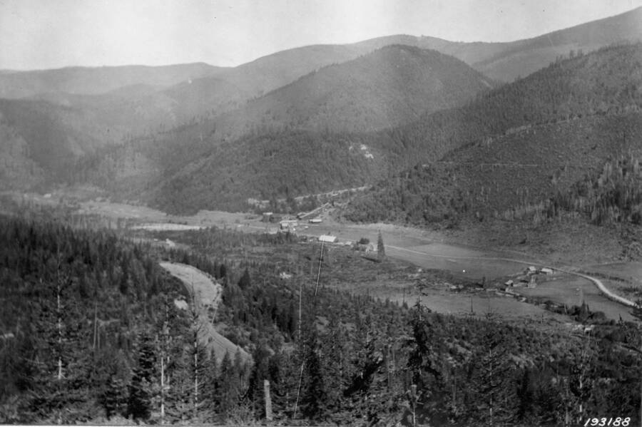 View of logged, burned, and timbered areas near Larson, Coeur d'Alene NF. Scene of some of the earliest cuttings in Idaho. Note Snow Storm Mill in valley.