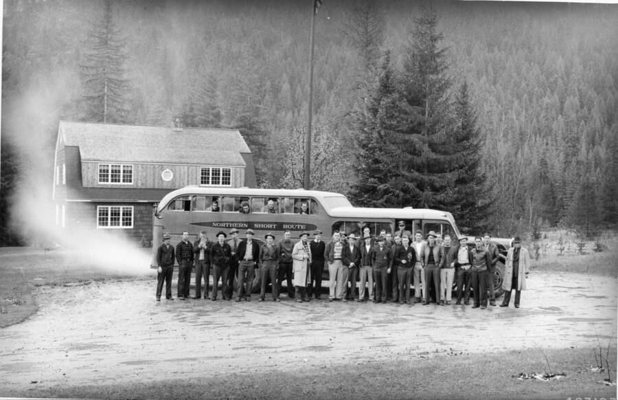 Montana Forest School seniors (and the bus in which they traveled) visiting the Priest River Experimental Forest (Idaho) to study research under way at this center.
