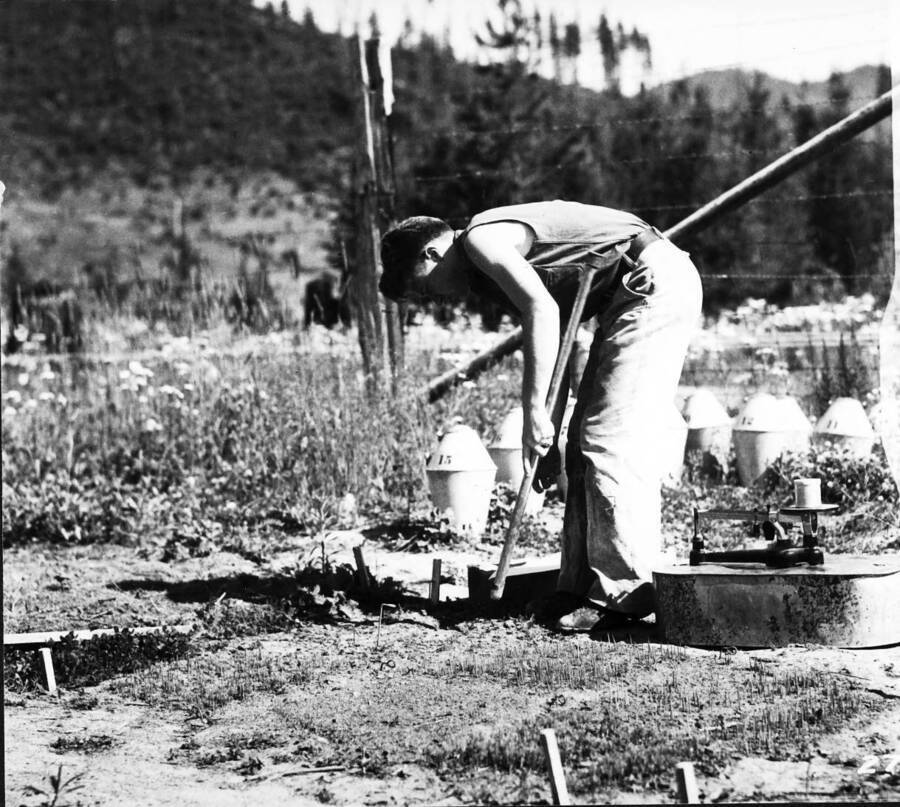 Taking soil samples at inflam. Station, Priest River Exp. For., Kaniksu N.F., Aug 1932. Chuck Wellner pictured.