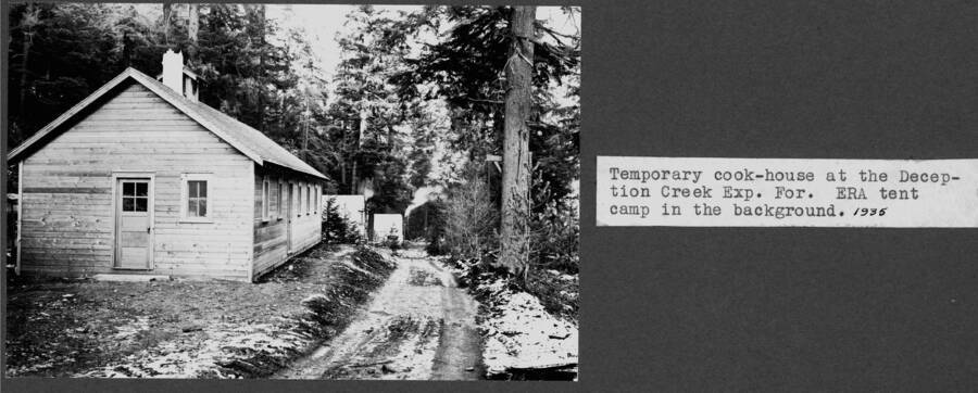 Temporary cook-house at the Deception Creek Exp. For.  ERA tent camp in the background. Deception Creek Experimental Forest. 1935.