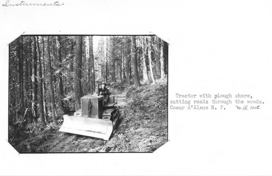 Tractor with plough share, cutting roads through the woods.  Coeur d'Alene National Forest