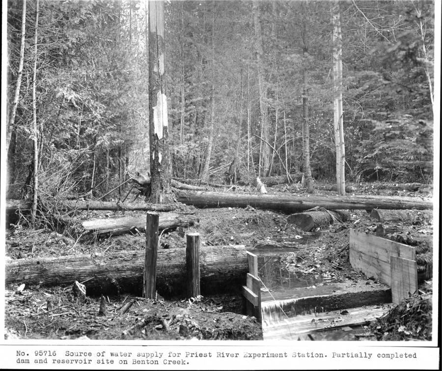 Source of water supply for Priest River Experiment Station. Partially completed dam and reservoir site on Benton Creek. From the 1912 Annual Report.