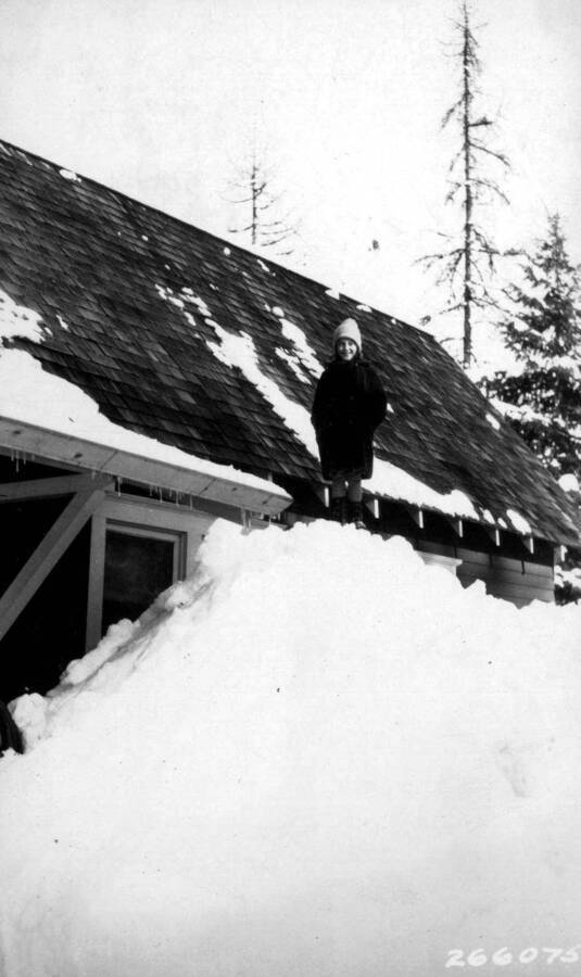 Snowbank at Cottage #2 Feb, 1932, Priest River Branch Station. Maybe older daughter of Thompson, Louise.