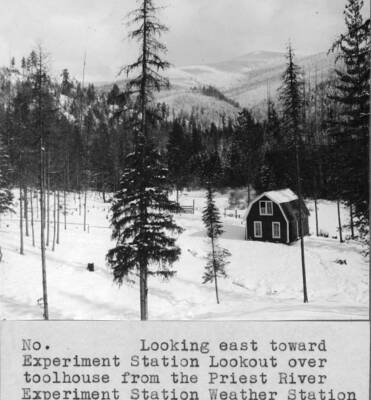 Looking east toward Experiment Station Lookout over toolhouse from the Priest River Experiment Station Weather Station in midwinter.