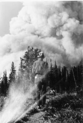 Gisborne observing the Half Moon fire on the north fork of the Flathead River.