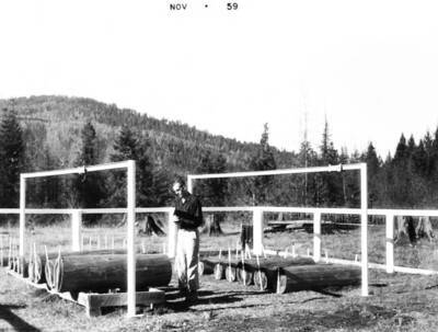 Bob Mutch, Priest Creek Experimental Forest Superintendent, at the large log moisture study.