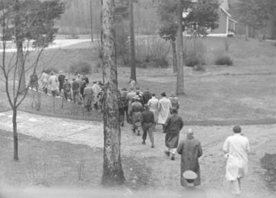 University of Montana students leaving the rear of the new  office/lab. Note the gravel walk ways and original lab in background.