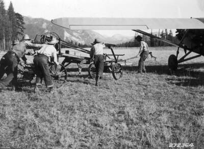 Road grader which was transported by plane from Missoula to Bartlett Creek landing field for use in constructing interior road along South Fork. [Flathead river?]