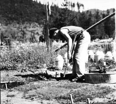 Taking soil samples at inflam. Station, Priest River Exp. For., Kaniksu N.F., Aug 1932. Chuck Wellner pictured.