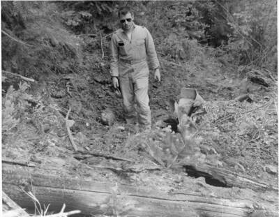 Man with bomb wreckage.