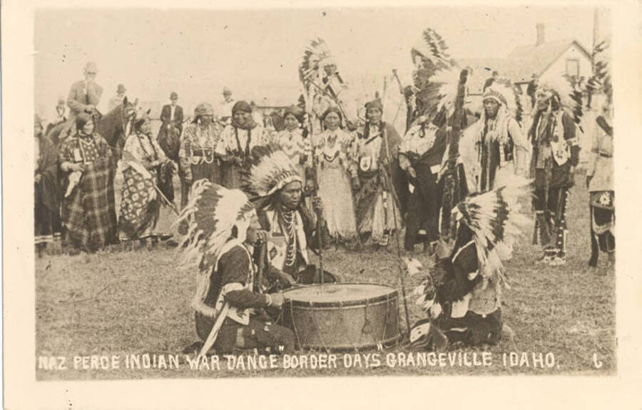 Postcard with photograph of Nez Perce Indian war dance from Grangeville, ID.