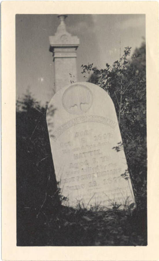 Photograph of the gravestone for Johnathan Chamberlin and his daughter, Hattie, killed by Nez Perce tribe members.