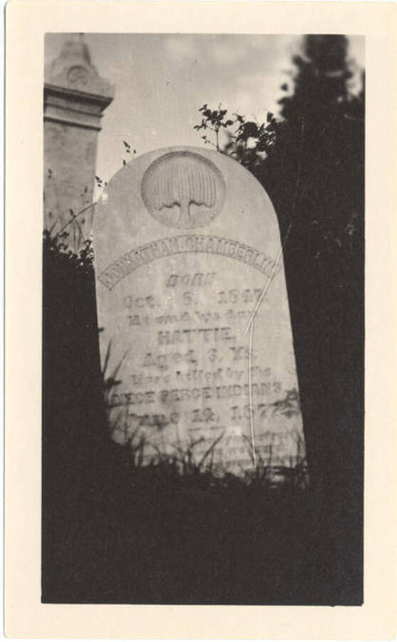 Photograph of the gravestone for Johnathan Chamberlin and his daughter, Hattie, killed by the Nez Perce Indians.