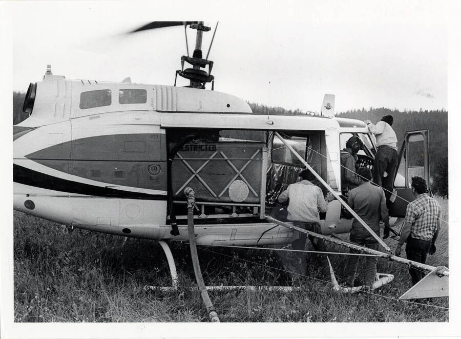 Evergreen Helicopter Bell-205 being serviced between sorties