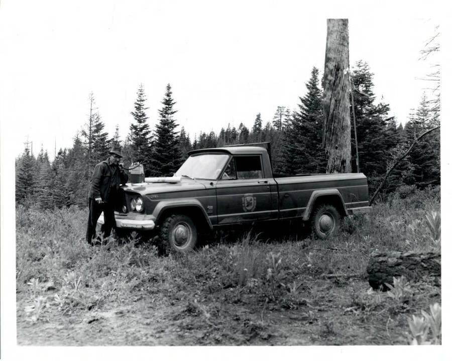 A Forest Service professional making a telephone call via portable telephone.