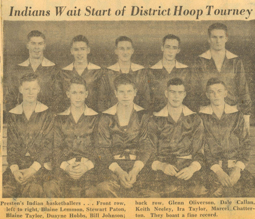 A group of ten young men in matching uniforms pose in two rows. Text above reads, "Indians Wait Start of District Hoop Tourney." The caption below identifies them as "Preston's Indian basketballers." The front row, from left to right, lists Blaine Lemmon, Stewart Paton, Blaine Taylor, Duayne Hobbs, and Bill Johnson. The back row lists Glenn Oliverson, Dale Callan, Keith Neeley, Ira Taylor, and Marcel Chatterton. They are described as boasting a fine record.