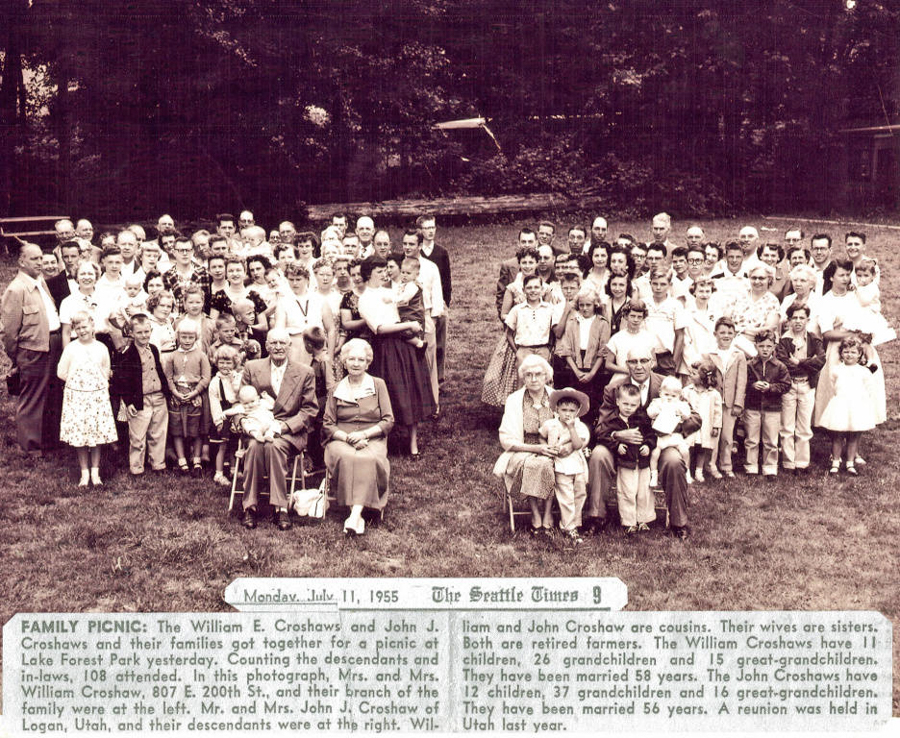 A large group of people stands together on a lawn, with some seated in front. The group includes men, women, and children of various ages. In the background, trees are visible. At the bottom, there is text from "The Seattle Times," dated Monday, July 11, 1955, detailing a family picnic of the William E. Croshaw and John J. Croshaw families. It mentions that 108 attendees were present, describing William and John as cousins and retired farmers, with information about their families and marriage durations.