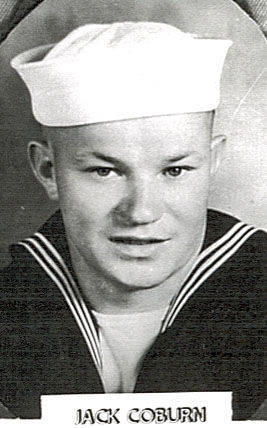 A person wearing a sailor uniform with a traditional sailor cap. The individual is looking at the camera with a slight smile. Below the image, there is text that reads "JACK COBURN."