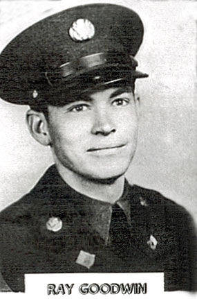 A man wearing a military uniform and cap, with insignia on both. He is facing forward with a neutral expression. Below the image, the text reads "RAY GOODWIN."