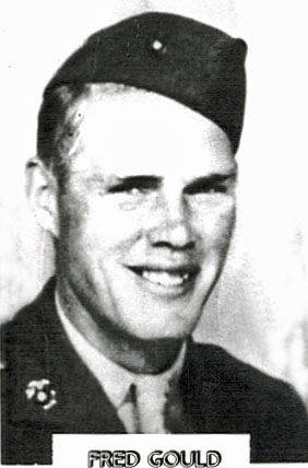 A man in military uniform is smiling. He is wearing a cap and a jacket with insignia on the collar. Below the image, the name "FRED GOULD" is printed.