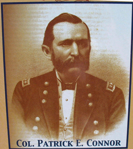 A portrait of a man in a military uniform with decorative buttons and shoulder insignia. He has a beard and is facing forward. Below the portrait, text reads "Col. Patrick E. Connor."