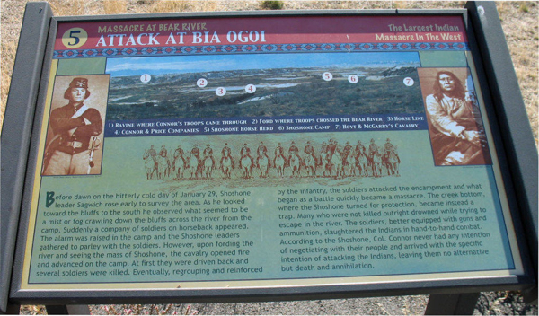A historical marker titled "Attack at Bia Ogoi" with the subtitle "Massacre at Bear River" and "The Largest Indian Massacre in the West." It includes a landscape illustration with numbered labels identifying significant locations: 1) Ravine where Connor's troops came through 2) Ford where troops crossed the Bear River 3) Horse line 4) Connor & Price companies 5) Shoshone horse herd 6) Shoshone camp 7) Hoyt & McGarry's cavalry. On the left, there is an image of a historical figure in uniform, and on the right, a seated figure. Below the images, there is a detailed narrative describing the events of January 29, involving Shoshone leader Sagwitch and the ensuing battle.