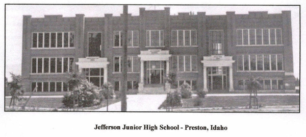 A large, symmetrical building with multiple windows and three prominent entrances. The structure is surrounded by small trees and shrubbery. The text below reads: "Jefferson Junior High School - Preston, Idaho."