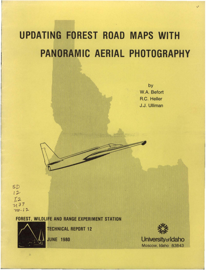 The report discusses the use of panoramic high-altitude air photographs to clearly depict forest roads and trails using a conventional image-transfer device to compensate for panoramic distortion.