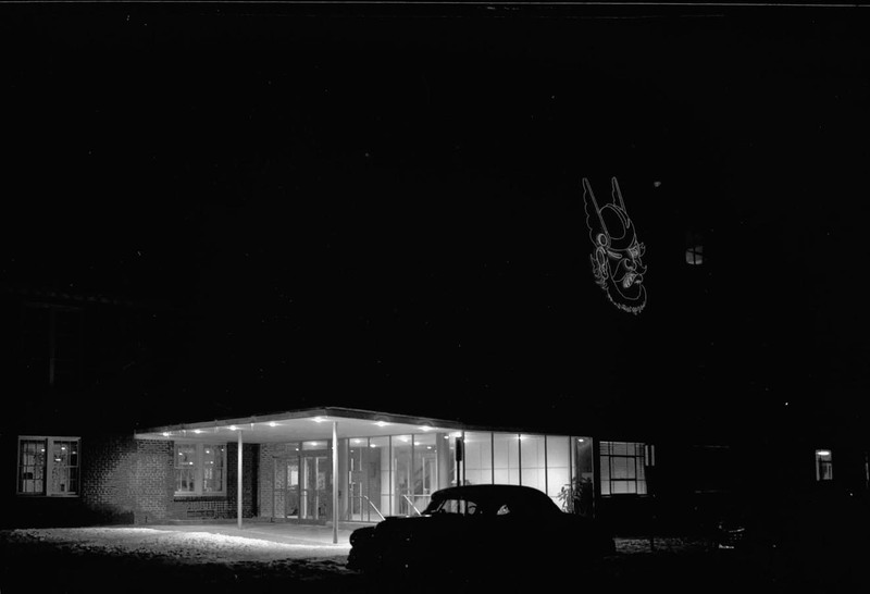 A photograph of the Student Union Building at night.