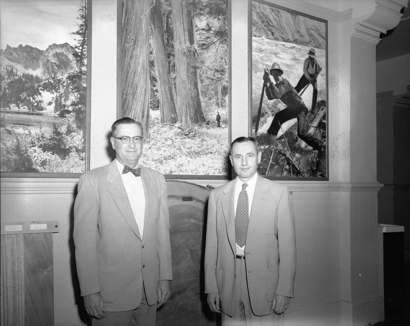 University of Idaho President J.E. Buchanan posing with new Dean of Forestry, Ernest Wohletz in the Natural Resources Building.