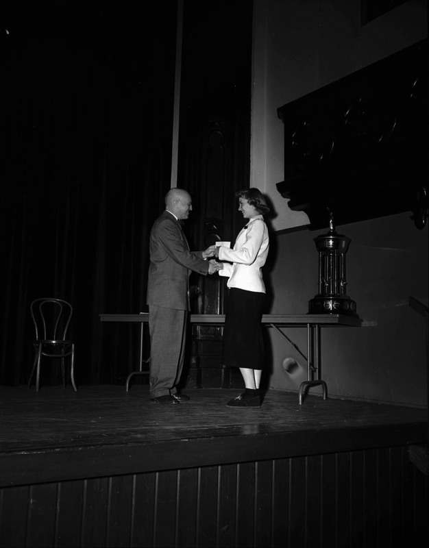 President Theophilus handing out awards at assembly.