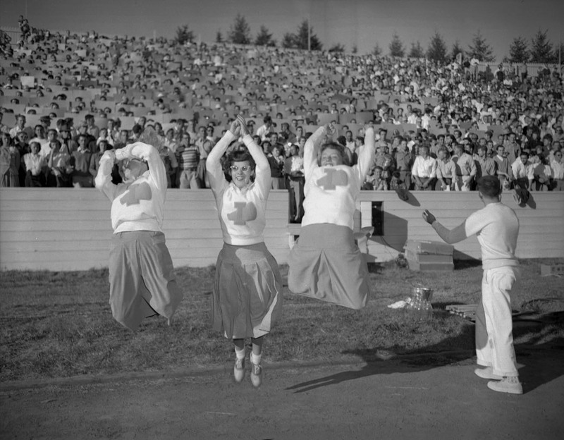 Cheerleaders performing at the Homecoming football game.