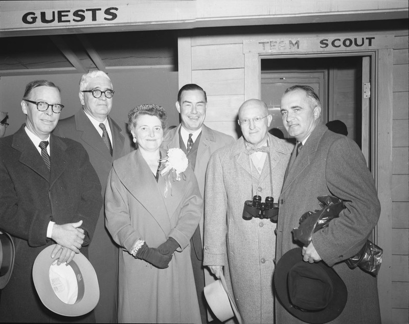 Federal and state dignitaries stop for a photo before attending homecoming activities at the University of Idaho. Pictured left to right: A.B. Guthrie, U.S. Senator Henry Dworshak, U.S. Representative Gracie Pfost, Governor Robert E. Smylie, University of Idaho President Donald Theophilus, and U.S. Senator Herman Welker. University of Idaho.