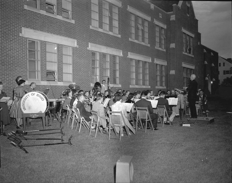 Students being led by conductor Carl Claus during outdoor orchestra practice outside of the Music Building.
