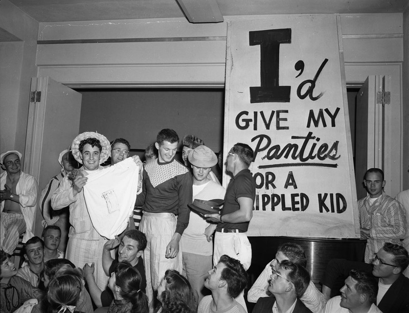 Students hold a panty raid with signs that read: "I'd give my panties for a crippled kid".