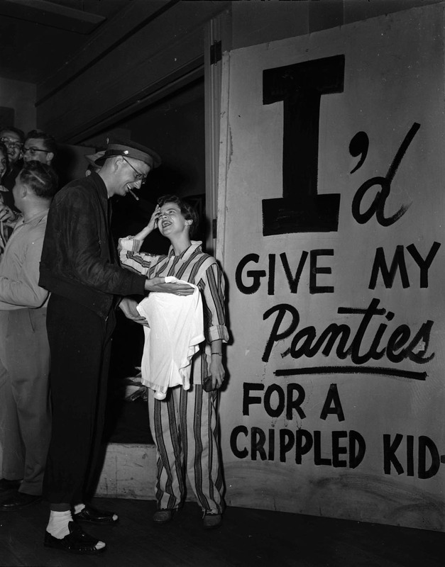 Students hold a panty raid with signs that read: "I'd give my panties for a crippled kid".