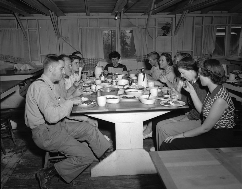 Hiking students eat in their cabin during summer classes.