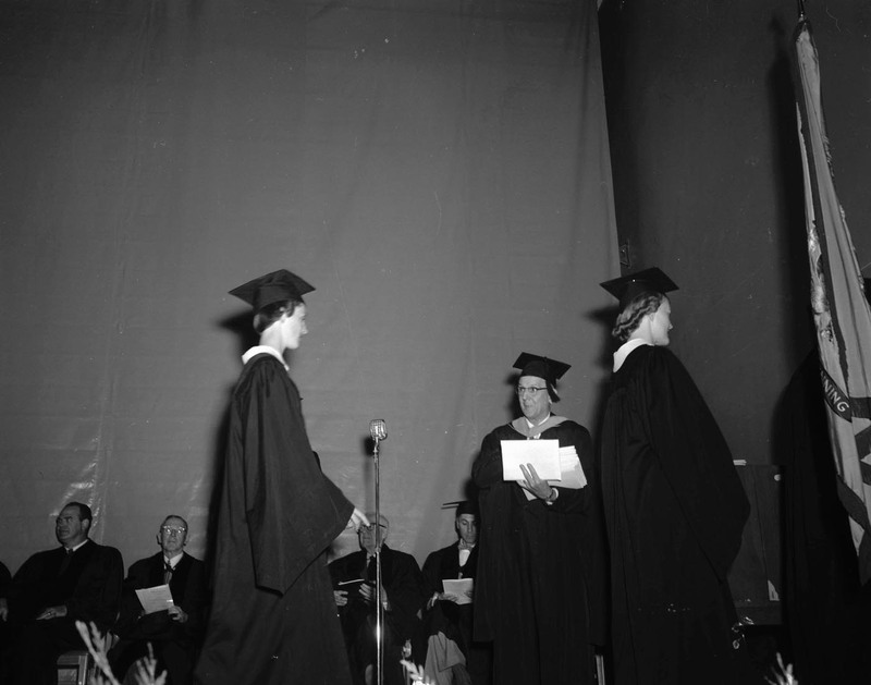 Students receive awards while on stage.