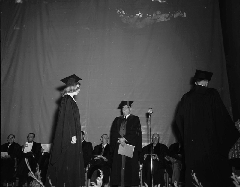 Students receive awards while on stage.