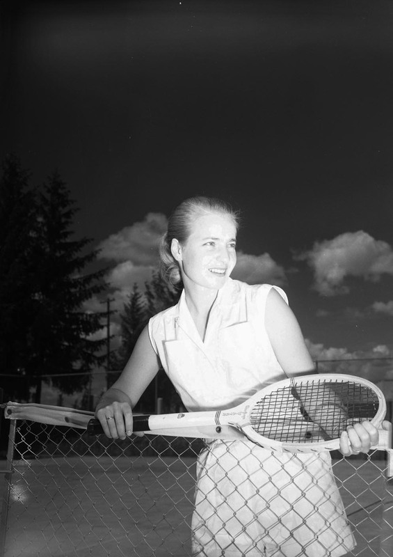 Tennis team member Sissel Andreason gets her portrait taken on the tennis court.