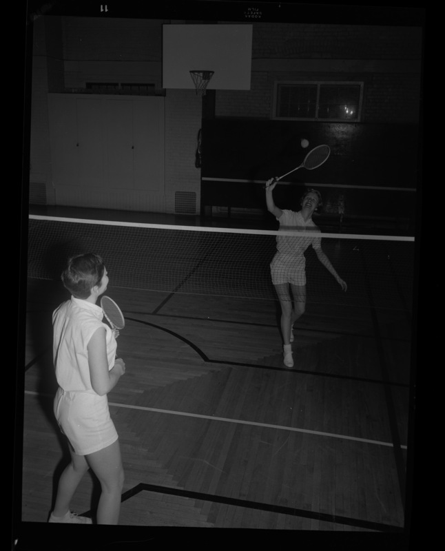Women's physical education class playing badminton in the Women's Gymnasium, now Art and Architecture South.