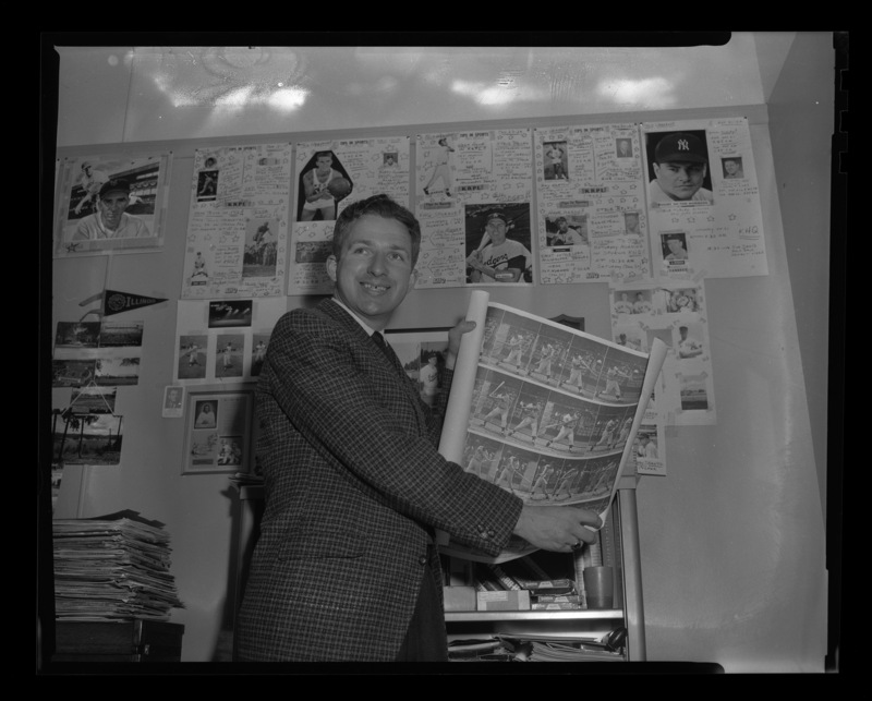 The University of Idaho Baseball team assisant coach Don Weiskopf showing off his baseball poster.