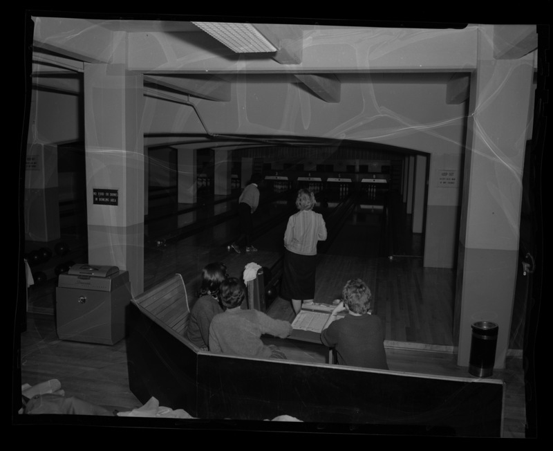 Women bowling for a physical education class at the University of Idaho bowling alley in the SUB.
