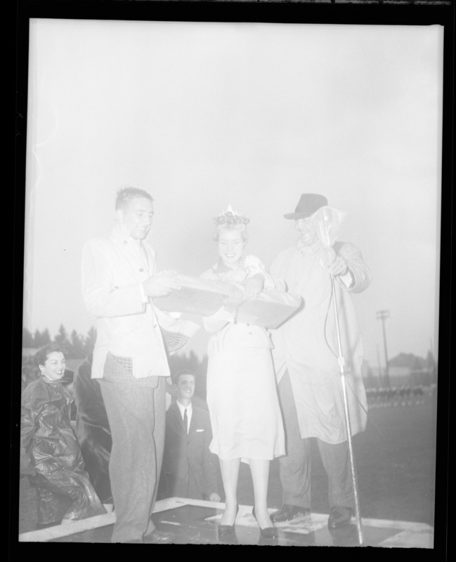 Homecoming queen Charmaine Deitz being presented at the 1958 Homecoming Game.