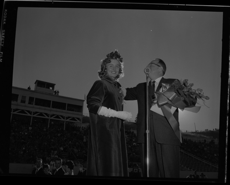 Homecoming queen Trenna Atchley being presented by Elbert Stellmon at the 1959 Homecoming Game.