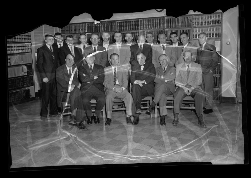 College of Law faculty and students. Seated (l-r): Faculty member Herbert Berman, faculty member Philip Peterson, faculty member George Bell, Professor M.J. O'Reilly, unidentified, and E.S. Stimson, Dean of the College of Law.
