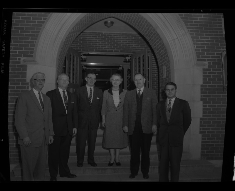 Choral Clinic of Northwest College Directors attendees stand together outside of the Lionel Hampton School of Music. Individuals identified from left to right: Wallace Pefley, Charles W. Davis, Glen Lockery, Ruth Sampson Ayers, Leonard Martin, Joachim Birke.