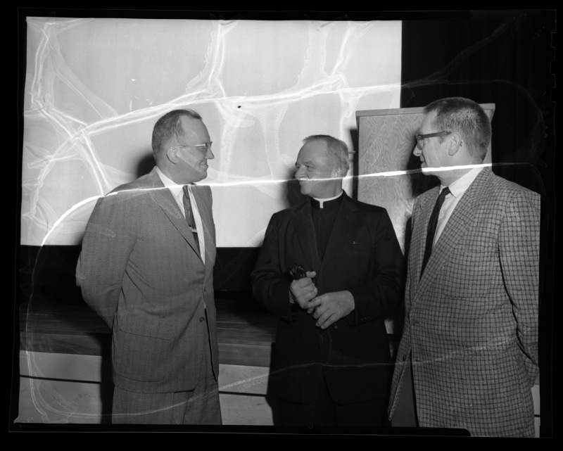 Rev. Daniel Linehan (center) from Boston College with College of Mines Dean, Earl F. Cook (left), and faculty member Guy Anderson (right).
